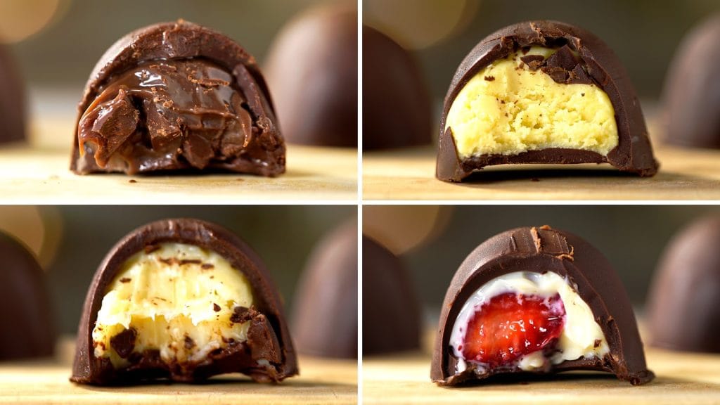 Quatro trufas de chocolate cortadas ao meio, mostrando diferentes recheios cremosos: chocolate cremoso, creme de baunilha, e um com morango fresco.